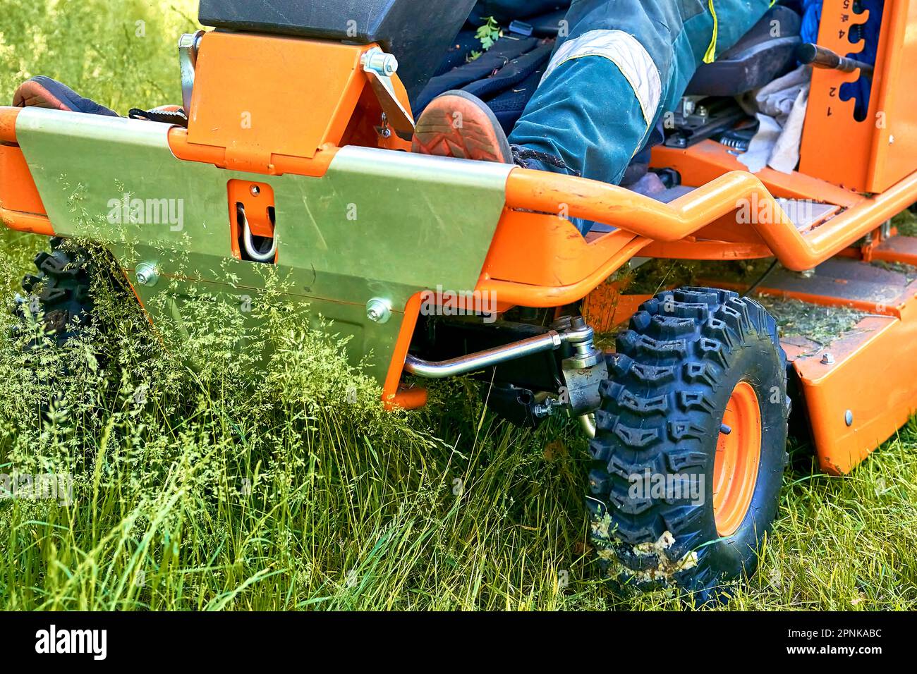 Professional grass cutting on lawns with a mini tractor lawn mower