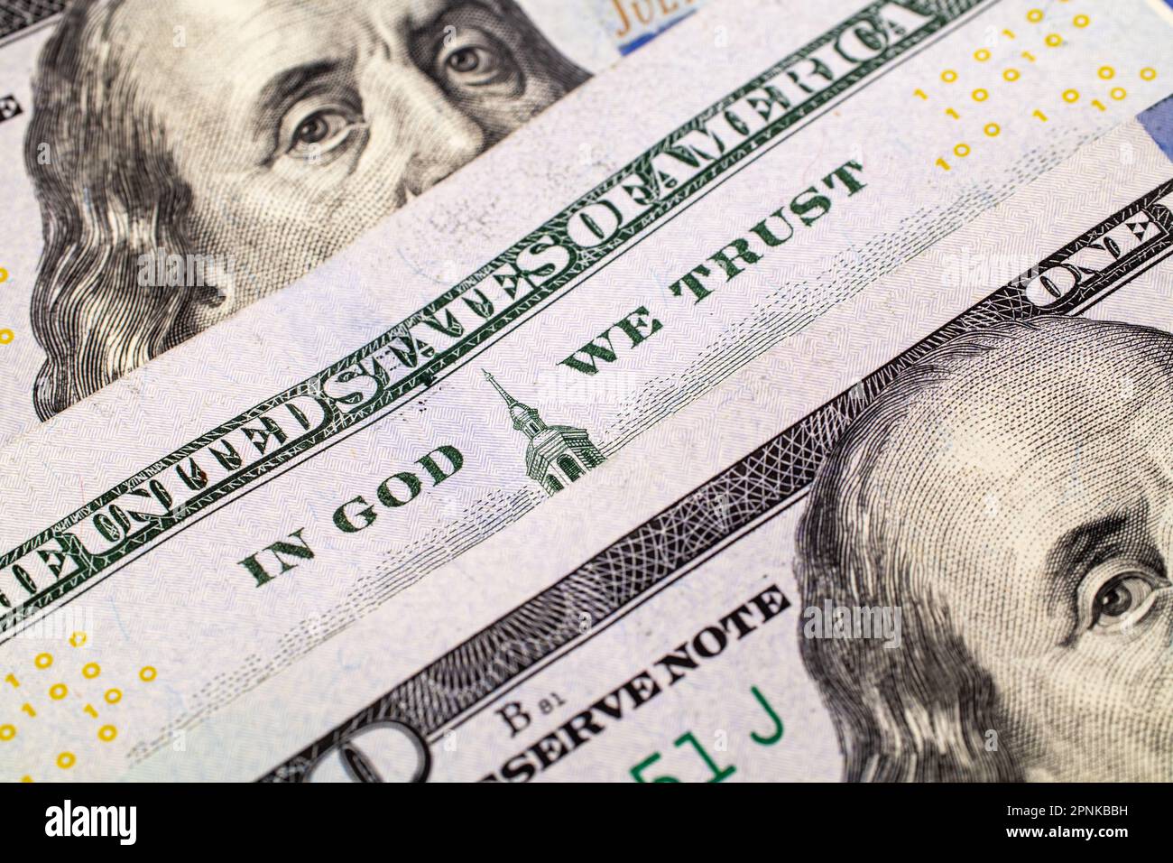 Extreme close-up of one hundred bill. Macro. American paper money. A $100 bill with focus on In God We Trust. US banknotes close-up. Business economy Stock Photo