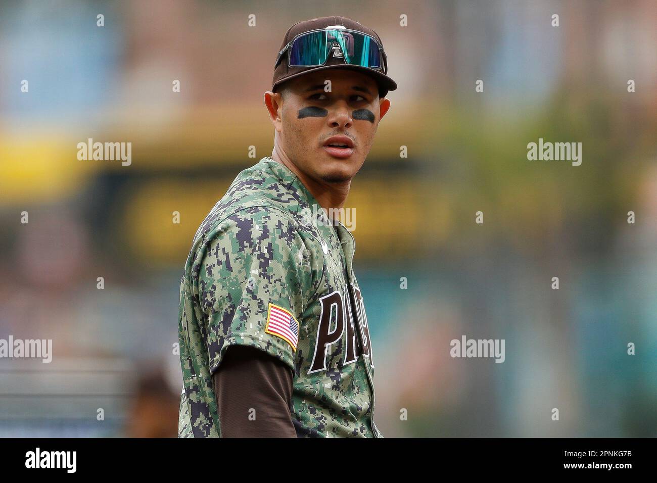 San Diego Padres third basemen Manny Machado (13) ties his shoes