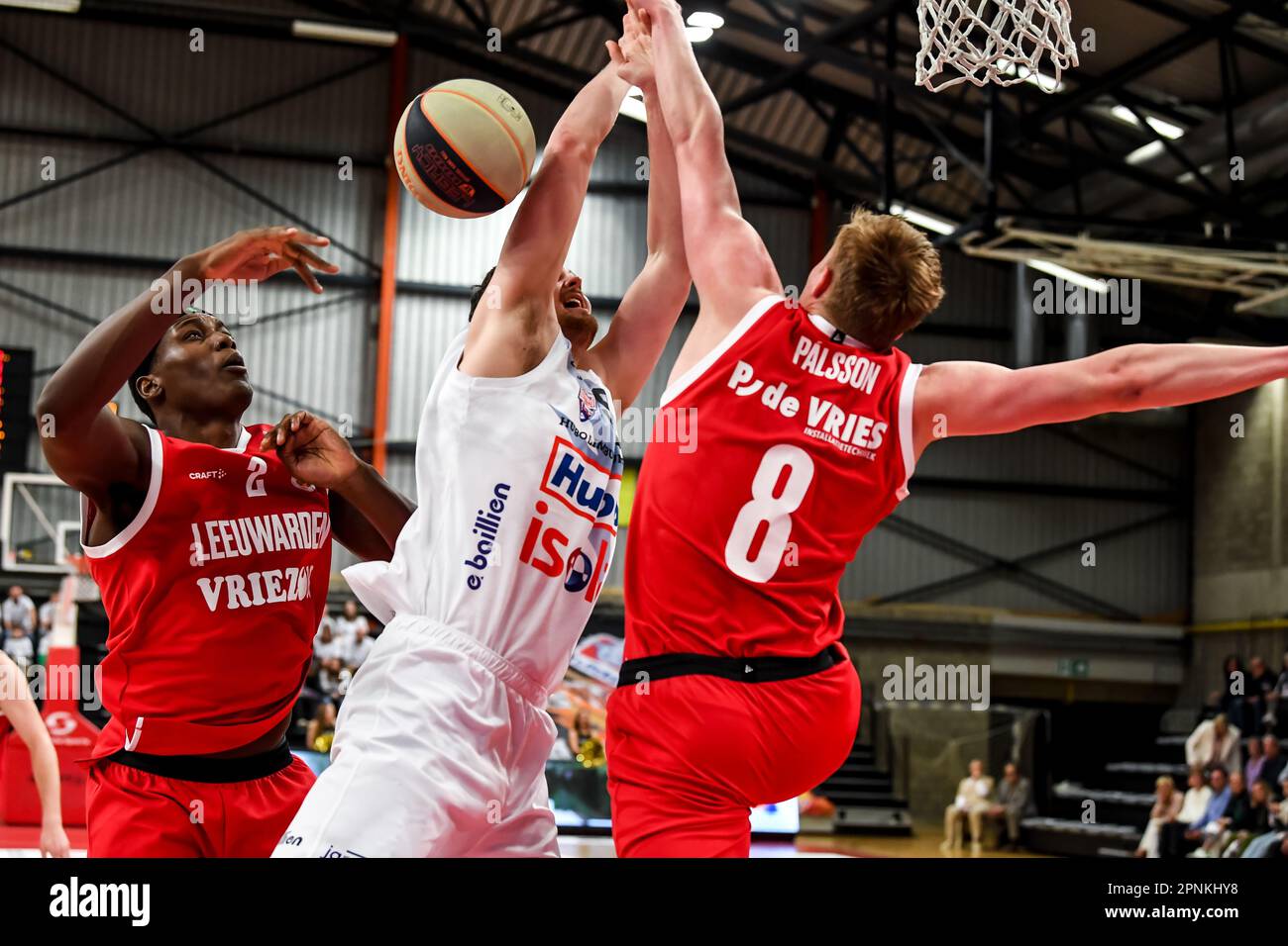 Limburg, Belgium. 19th Apr, 2023. Leeuwarden's Jason Dourisseau, Limburg's Jonas Delalieux and Leeuwarden's Kristinn Palsson pictured in action during a basketball match between Limburg United (Belgium) and Aris Leeuwarden (Netherlands), Wednesday 19 April 2023 in Limburg, on day 8 (out of 10) in the elite Gold, cross-boarder phase of the 'BNXT League' Belgian and Netherlands first division basket championship. BELGA PHOTO JILL DELSAUX Credit: Belga News Agency/Alamy Live News Stock Photo