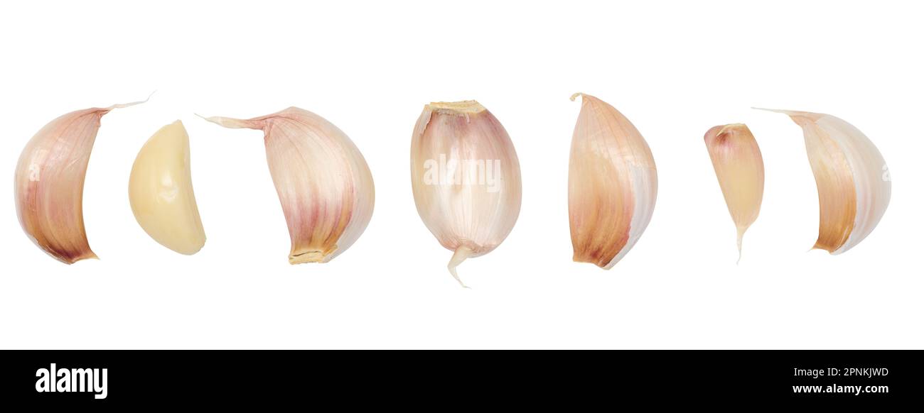 Peeled and unpeeled garlic on a white isolated background Stock Photo