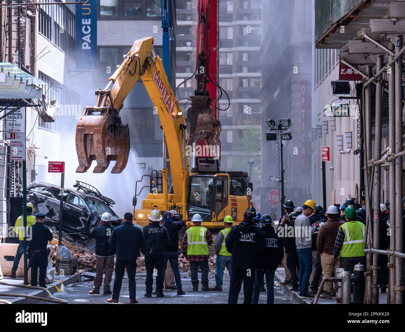 New York, New York, USA. 19th Apr, 2023. The aftermath of deadly downtown NYC parking garage collapse as workers start removing demolished cars. One garage worker killed and 5 injured in the collapse of the 100 year old four story structure in the financial district. The cause is under investigation. (Credit Image: © Milo Hess/ZUMA Press Wire) EDITORIAL USAGE ONLY! Not for Commercial USAGE! Stock Photo