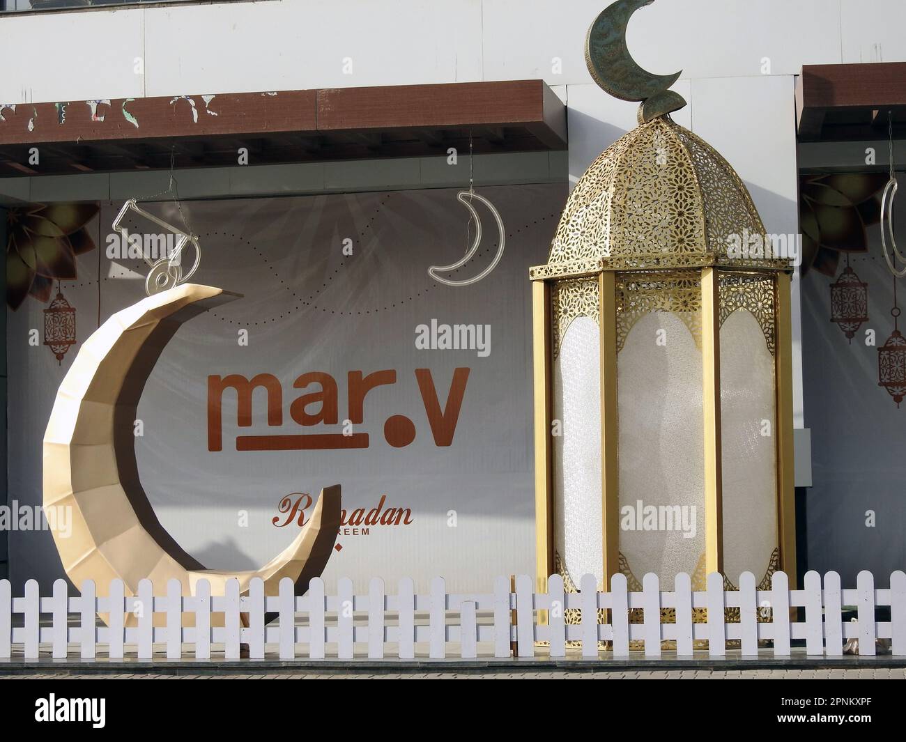 Cairo, Egypt, April 18 2023: festive decorations of Islamic Ramadan fasting month in Egyptian streets Ramadan fanous Lantern lamps with crescent moon Stock Photo