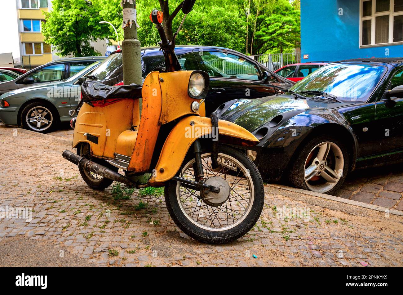 Berlin, Germany - April 30, 2014: Old motorcycle. Vintage orange motorcycle on parking area in Berlin, Germany. Stock Photo