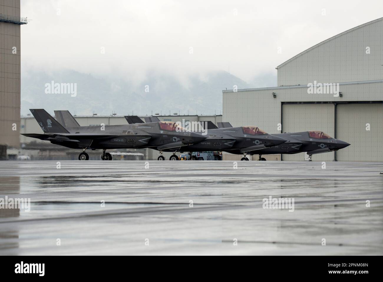 U.S. Marine Corps F‐35B Lightning II aircraft with Marine Fighter Attack Squadron (VMFA) 242 and VMFA‐121 prepare to taxi the runway at Marine Corps Air Station Iwakuni, Japan, April 12, 2023. Marines with Marine Aircraft Group 12 and U.S. Navy Sailors with Carrier Air Wing Five conducted a joint, live missile shoot over the Pacific to sustain their high‐level of weapon proficiency, while serving as forward‐postured aviation units in the Indo‐Pacific region. (U.S. Marine Corps photo by Lance Cpl. Samantha Rodriguez) Stock Photo