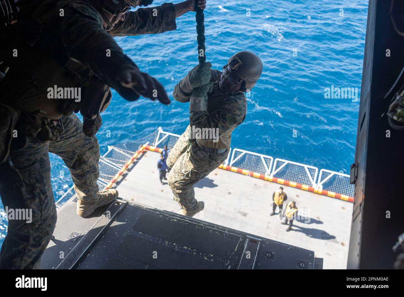 A U.S. Marine with the 26th Marine Expeditionary Unit (MEU), fast ropes ...