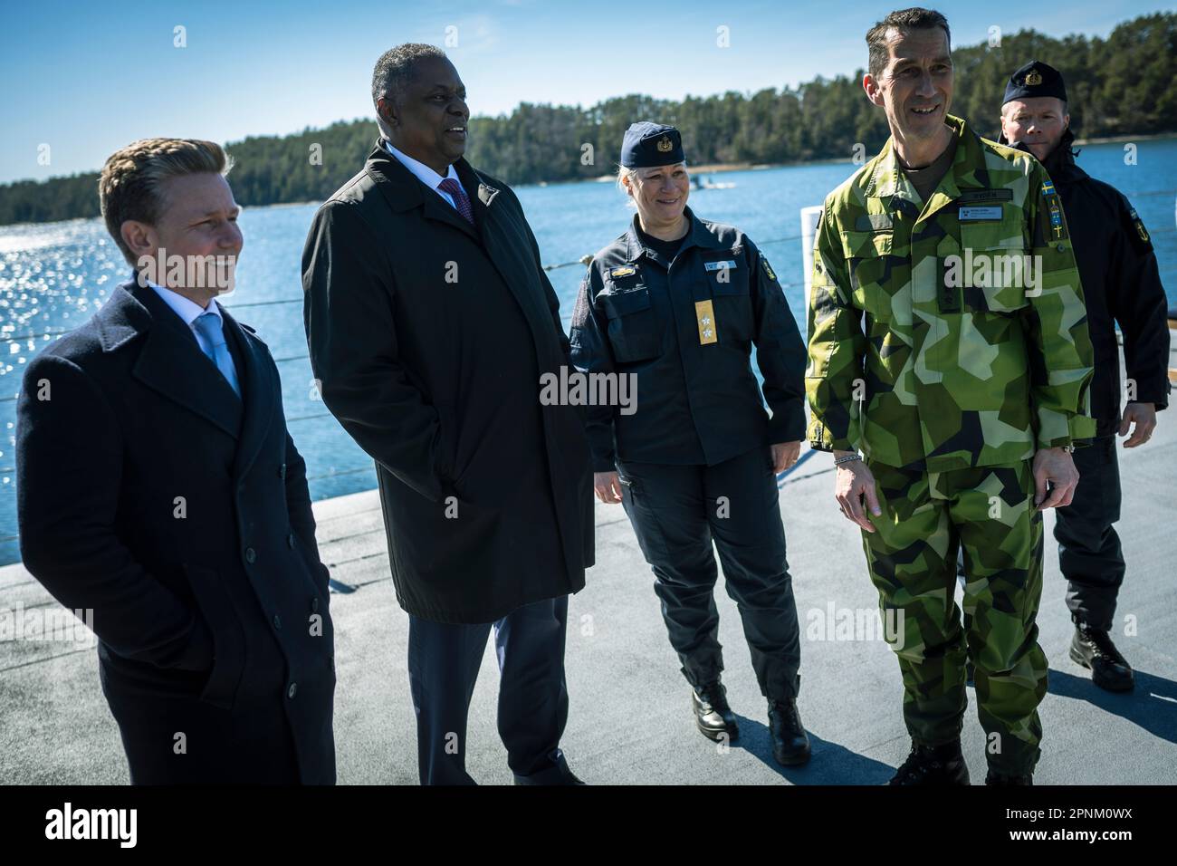 Swedish Minister of Defense, Pat Jonson, Secretary of Defense Lloyd J. Austin III, Swedish Chief of the Navy, Rear Adm. Ewa Ann-Sofi Skoog Haslum and Supreme Commander of the Swedish Armed Forces, Gen. Micael Bydén tour the Swedish Visby-class corvette, HSwMS Härnösand (K33) at Musko Naval Base, Sweden, April 19, 2023. While in Sweden, Secretary Austin will discuss security-related topics of mutual interest between the two nations and speak with senior Swedish defense and government officials. From Stockholm, Secretary Austin will travel to Germany where he and Chairman of the Joint Chiefs of Stock Photo