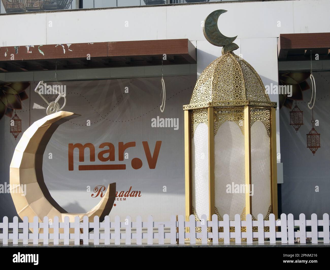 Cairo, Egypt, April 18 2023: festive decorations of Islamic Ramadan fasting month in Egyptian streets Ramadan fanous Lantern lamps with crescent moon Stock Photo