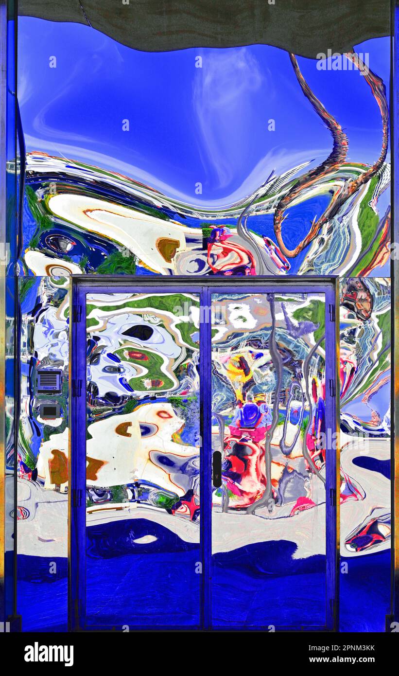 Spain Malaga modern chrome door reflecting distorted figures in the ...