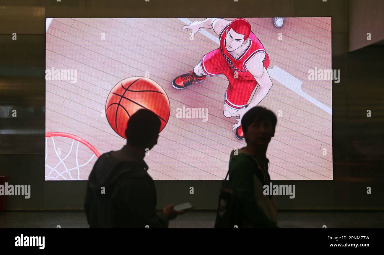 SHANGHAI, CHINA - APRIL 19, 2023 - Fans past a poster of the animated film Dunker at a cinema in Shanghai, China, April 19, 2023. Japanese cartoonist Stock Photo