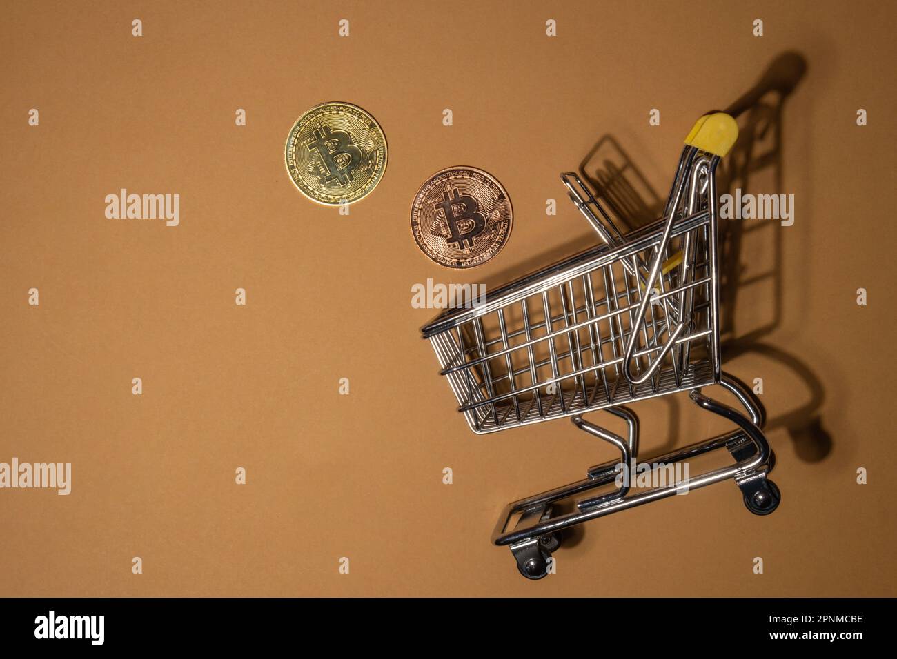 Bitcoin gold coin with shopping trolley cart Buying or selling mining trading concept. Financial crisis or inflation BTC golden money. Online purchases Worldwide virtual internet spending money Cryptocurrency or crypto digital payment system. shopping list Digital coin money farm in digital cyberspace Stock Photo
