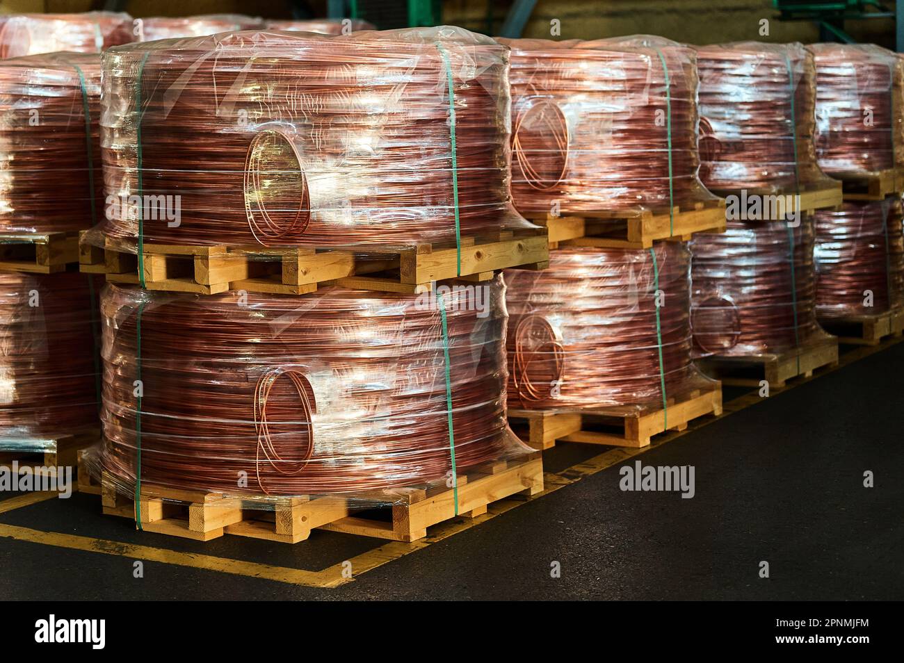 Rows of copper wire rod coils in production plant warehouse Stock Photo