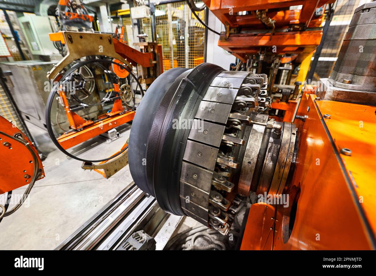 Rolling drum with rubber layers to form car tire at plant Stock Photo Alamy
