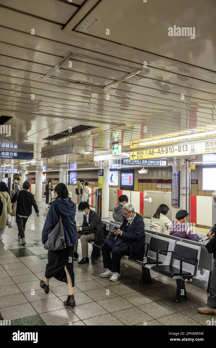 Tokyo metro train network April 2023, passengers at a Tokyo railway subway station wait for the next rain to arrive,Japan,Asia Stock Photo