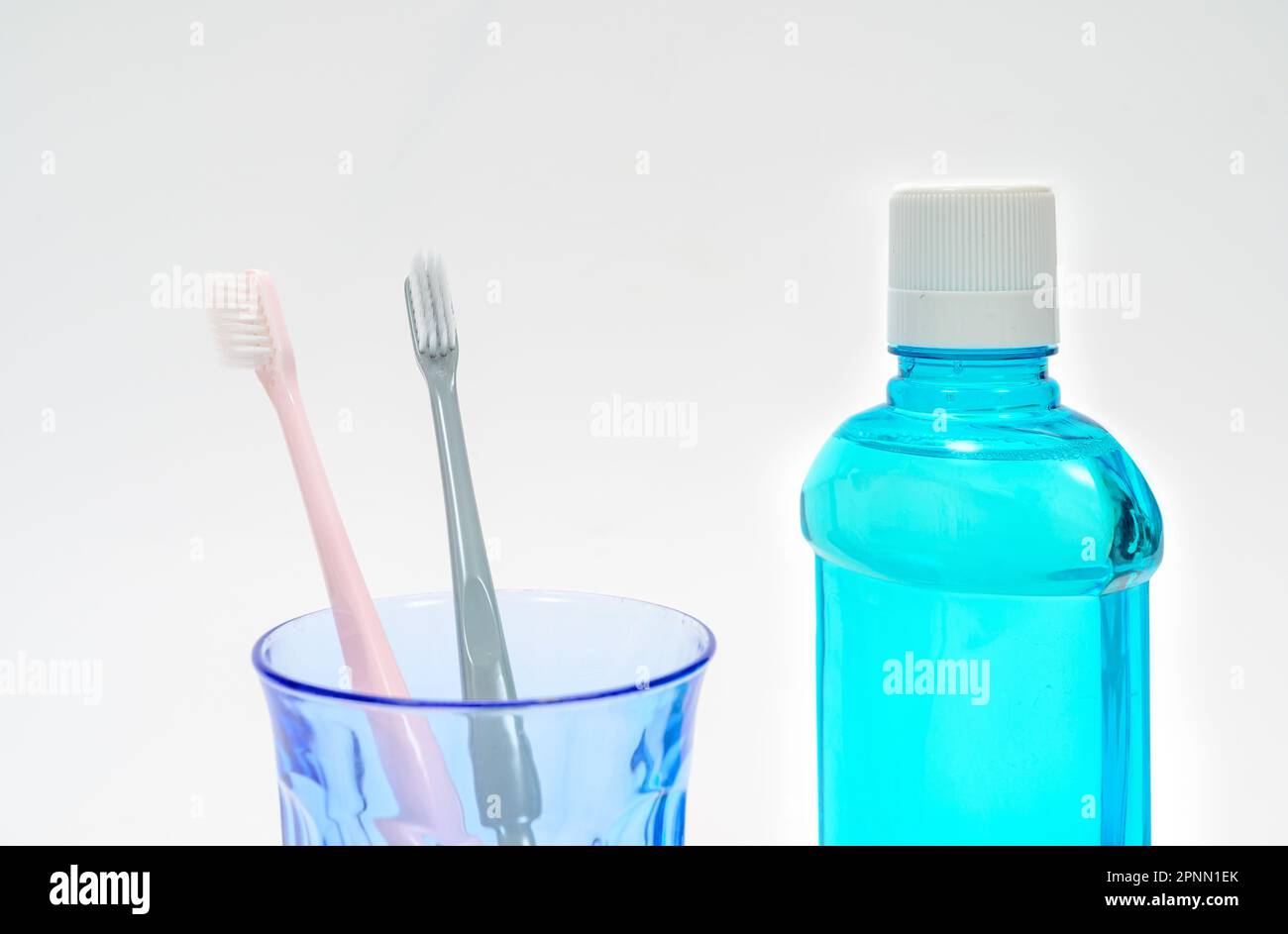 Toothbrush and mouthwash on white background Stock Photo