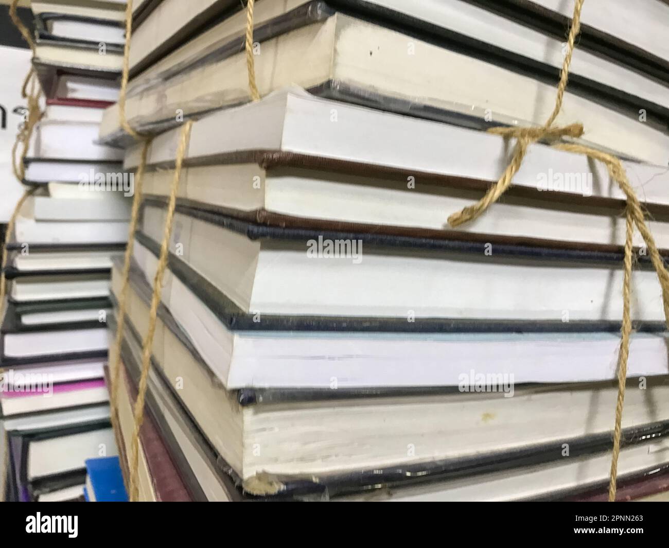 Wallpaper Ropes Book Pile of old books with rope background Stock Photo - Alamy