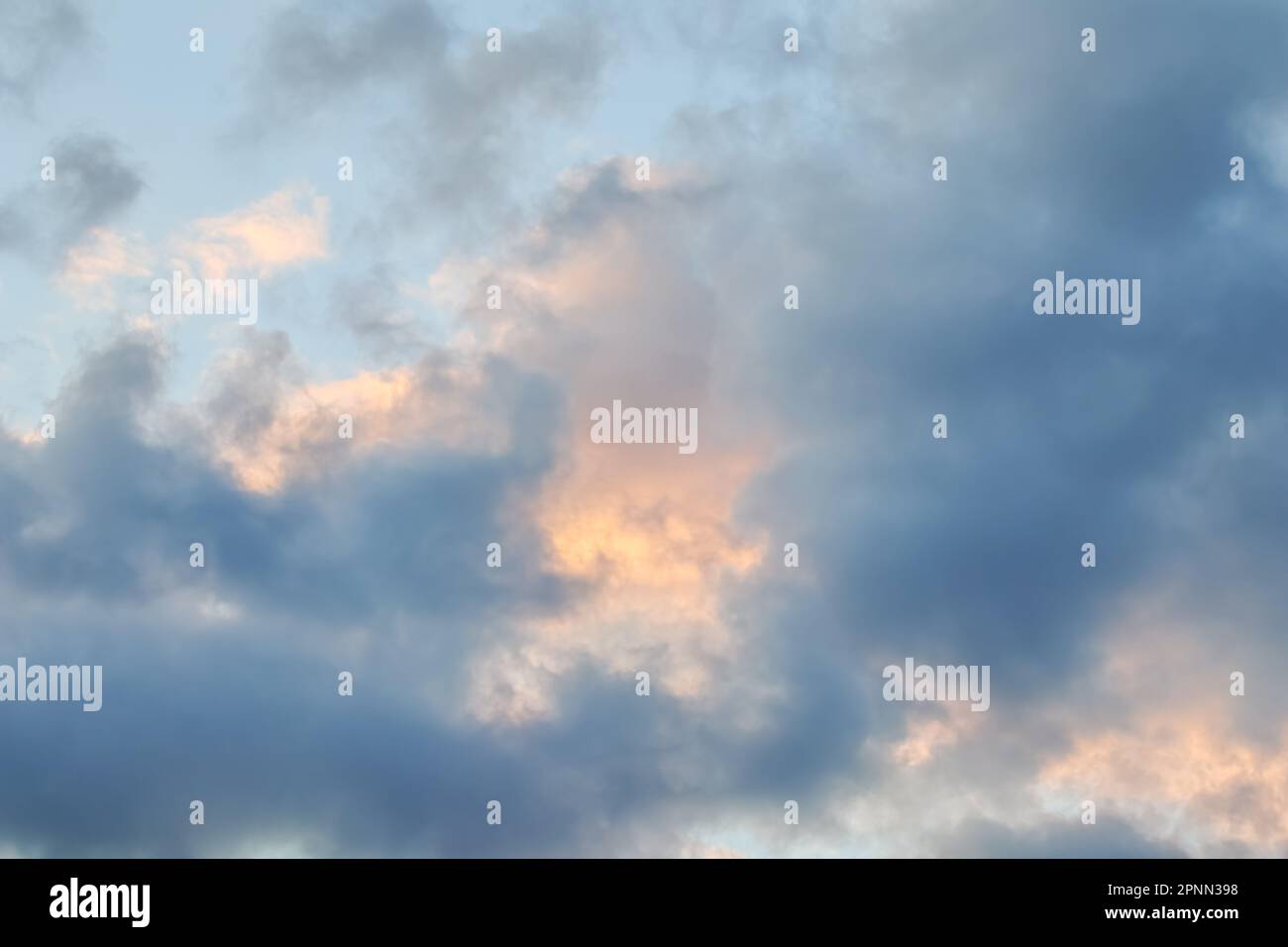 Cloudy sky background with dark and golden clouds at sunset Stock Photo ...