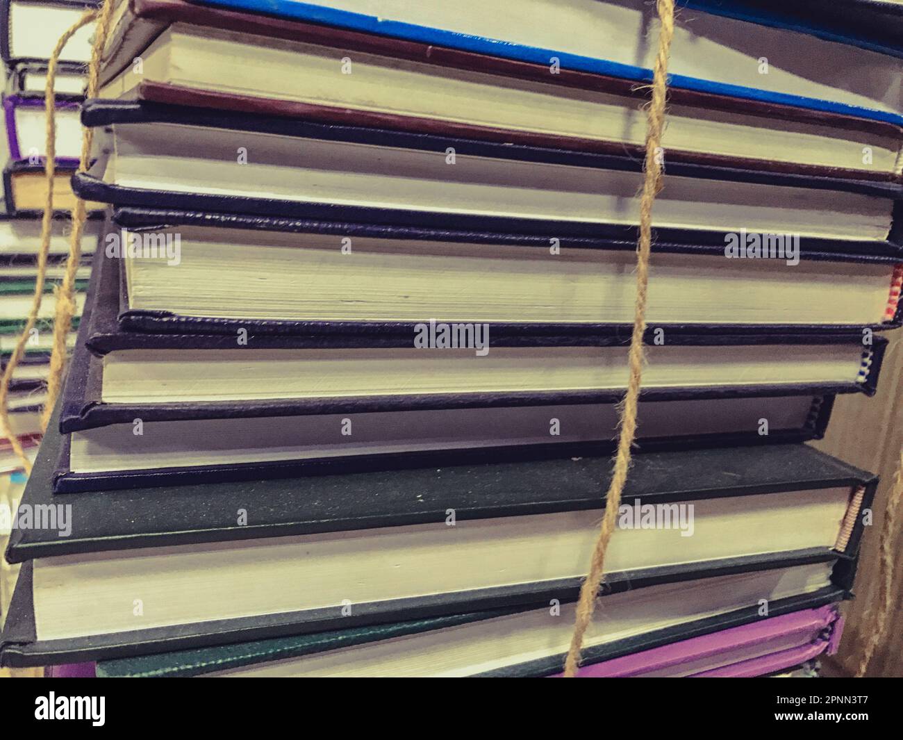 Wallpaper Ropes Book Pile of old books with rope background Stock Photo - Alamy