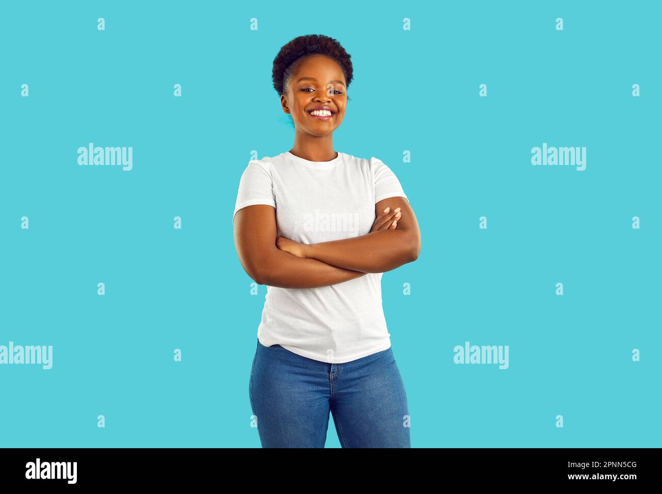 Portrait of a happy beautiful young African American girl in a white T shirt and jeans Stock Photo