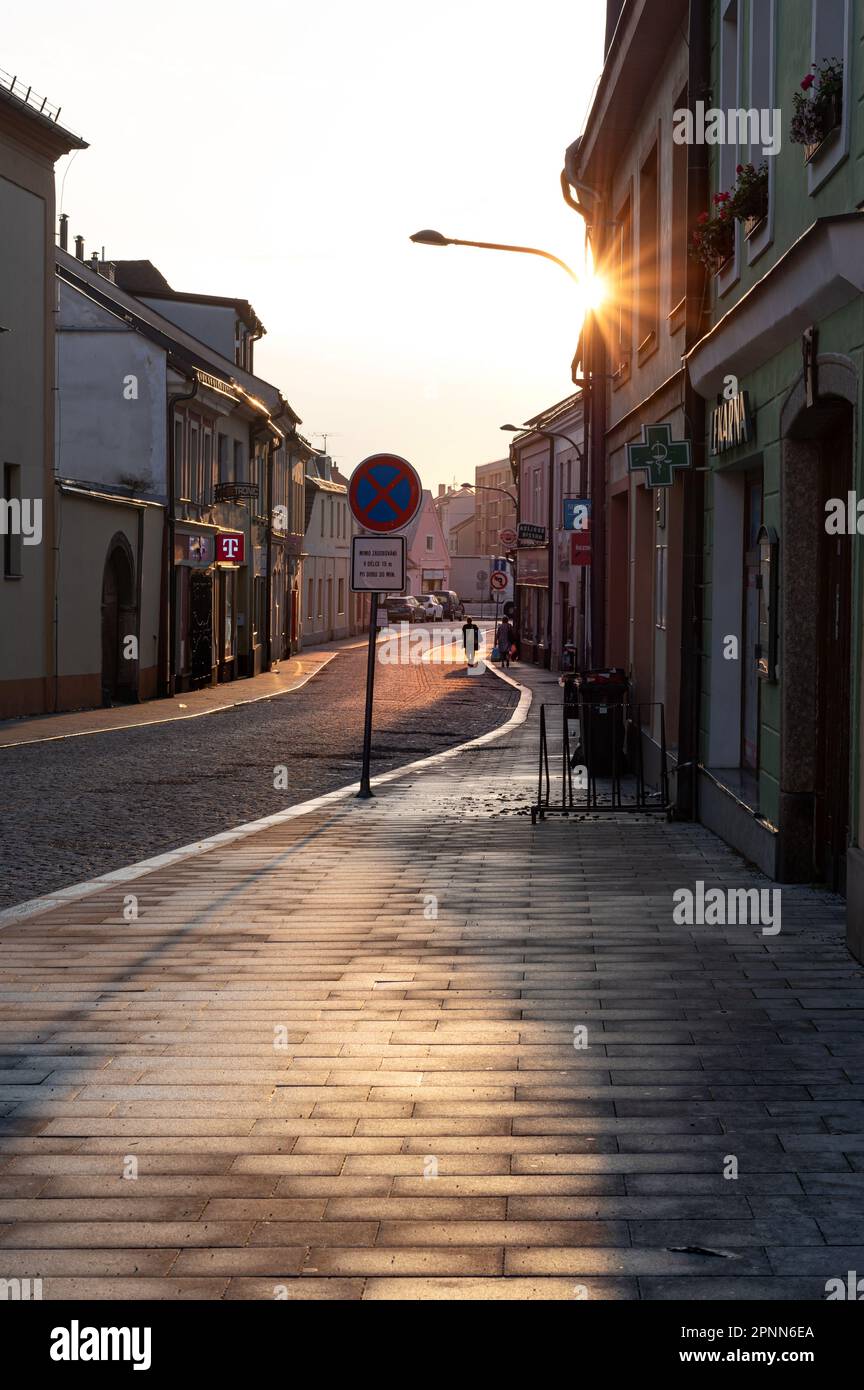 Czech city street in the rays of the rising sun Stock Photo