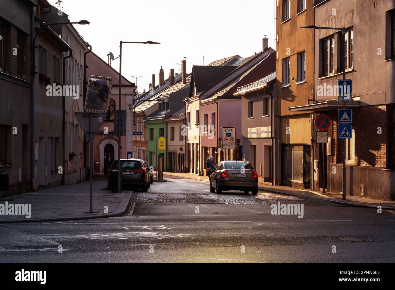 Czech city street in the rays of the rising sun Stock Photo