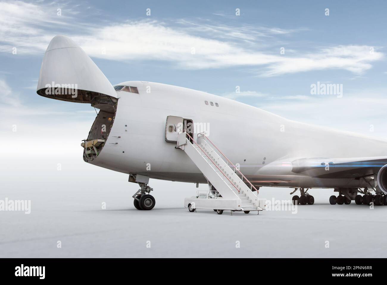 White wide body cargo airplane with an open nose hatch isolated on