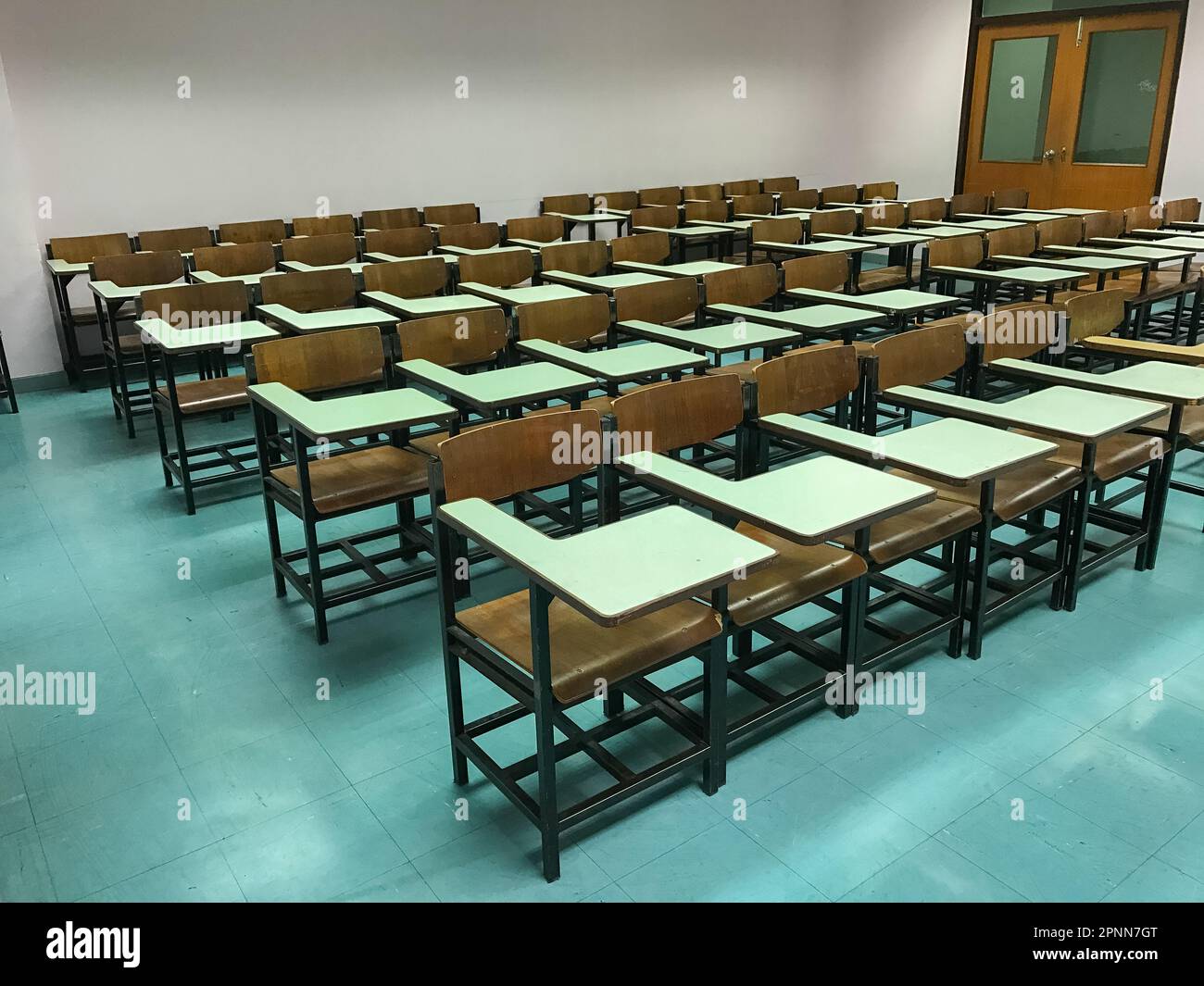 Wooden chairs in the classroom background Stock Photo - Alamy