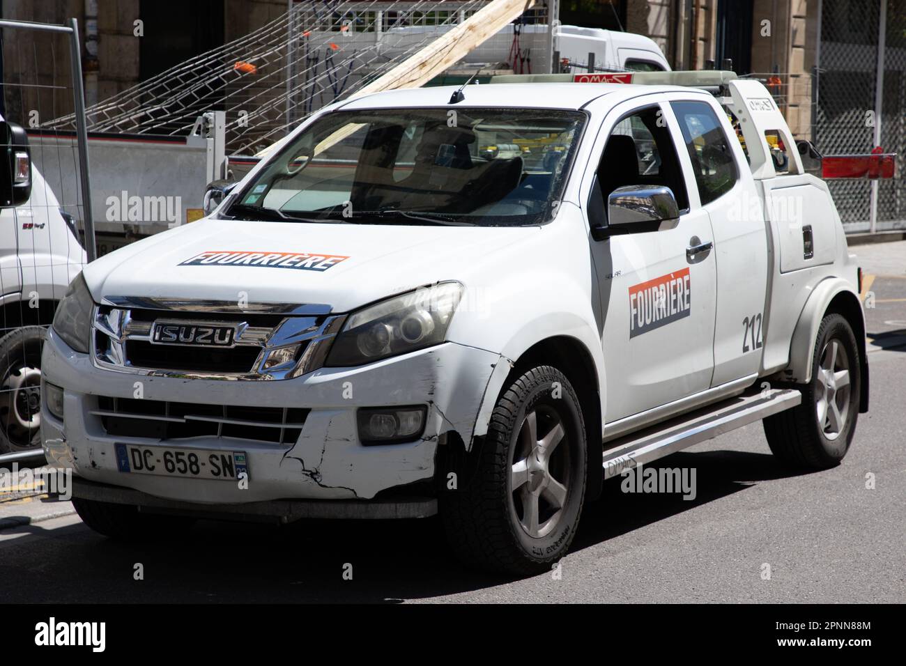 Bordeaux ,  Aquitaine France - 04 17 2023 : Isuzu logo brand and text sign fourriere french tow truck towing impounded vehicles for traffic violations Stock Photo