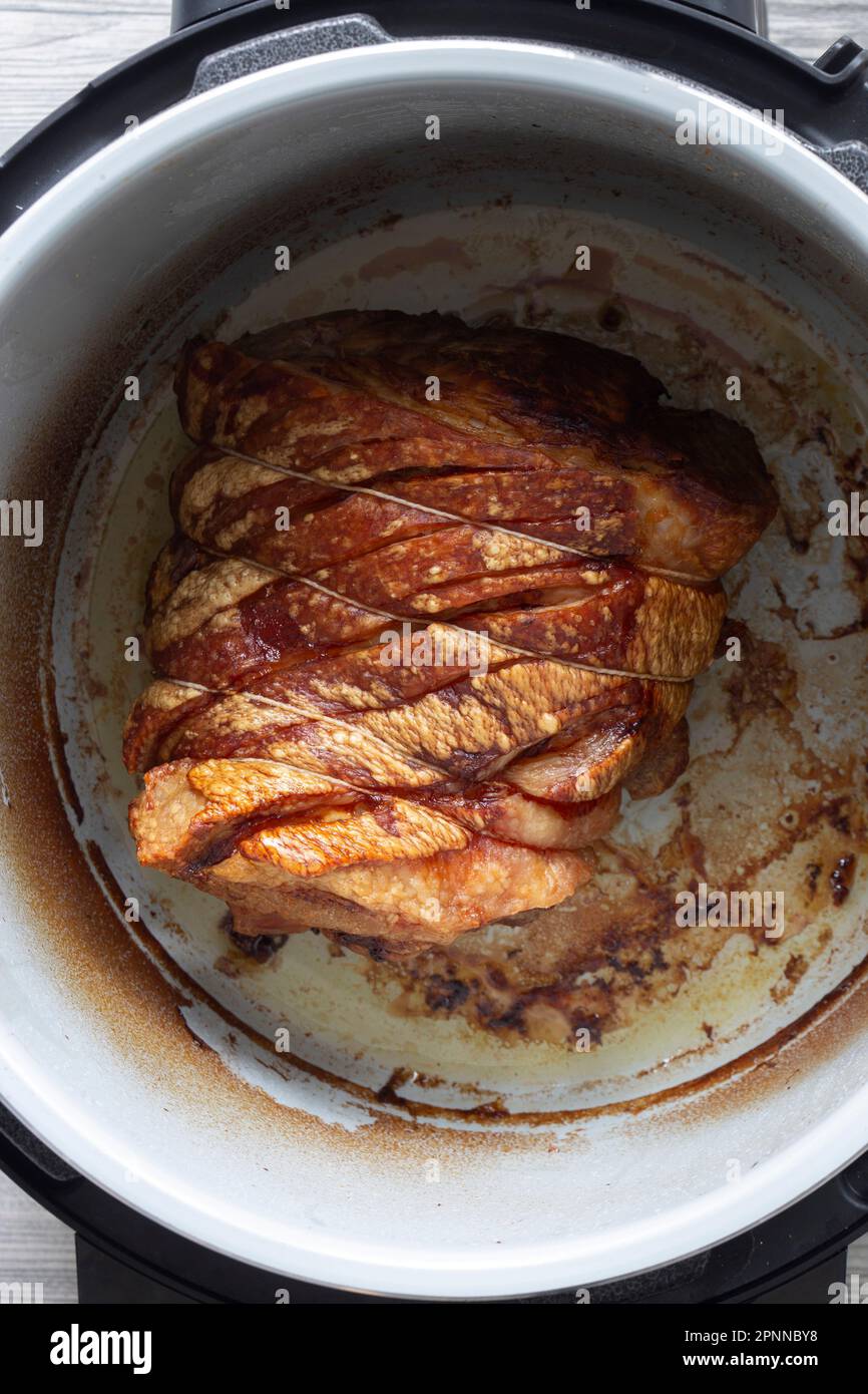 Pork shoulder joint of meat cooked in an air fryer. Healthy low cost