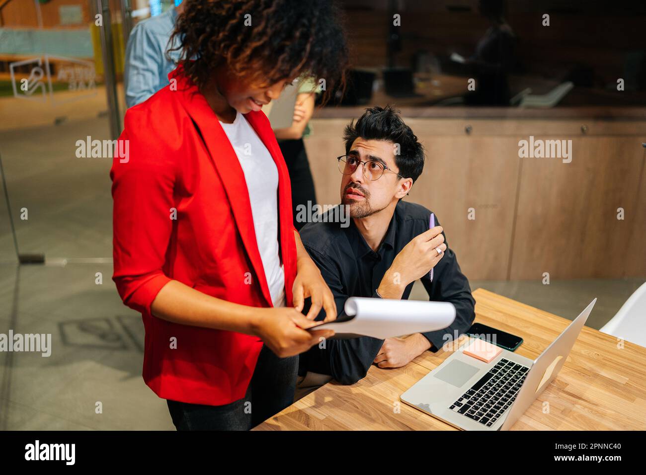 Young business female leader handing hi-res stock photography and ...