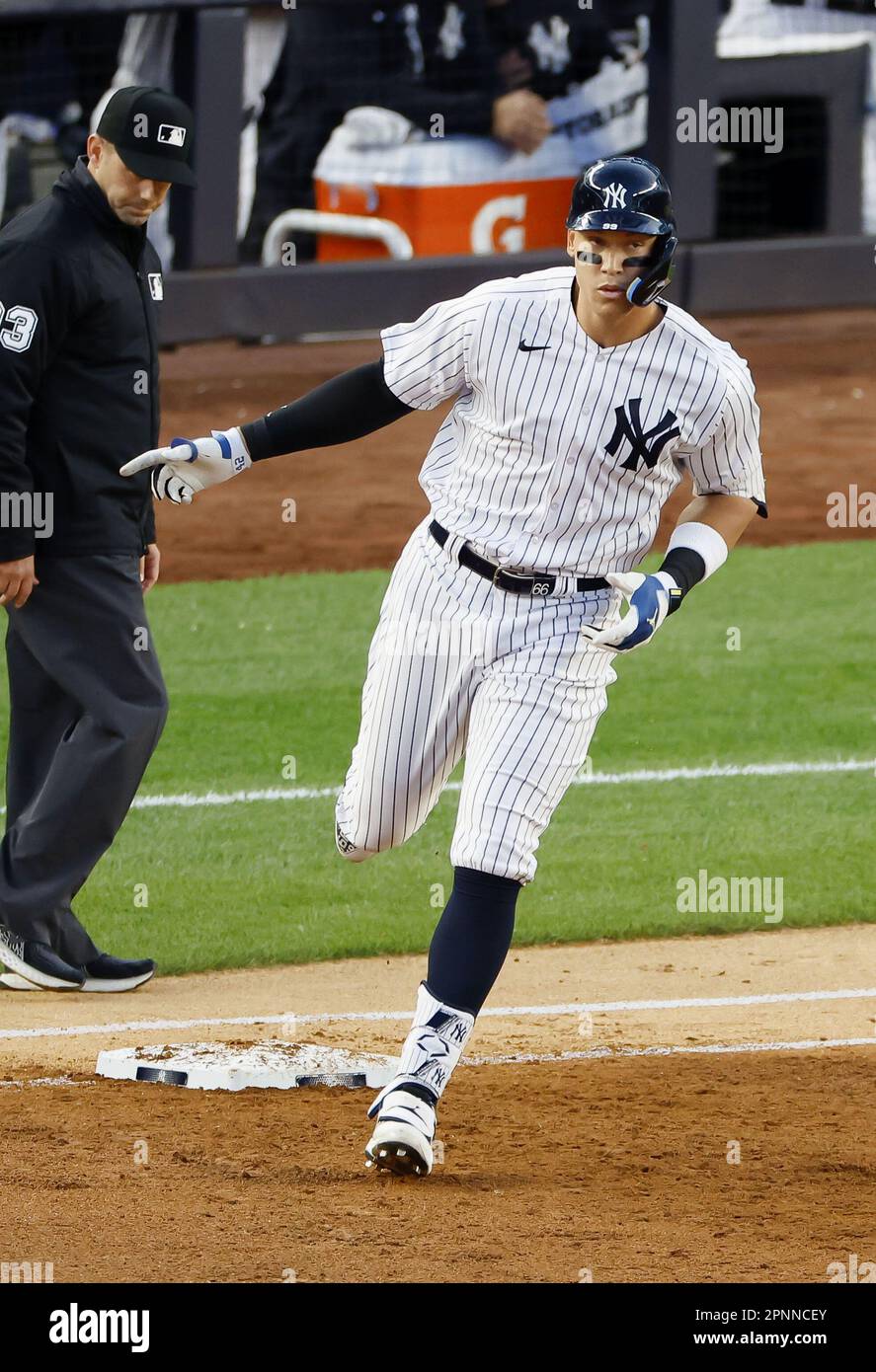Aaron Judge of the New York Yankees rounds the bases after hitting a  two-run homer during the first inning of a baseball game against the Los  Angeles Angels at Yankee Stadium in