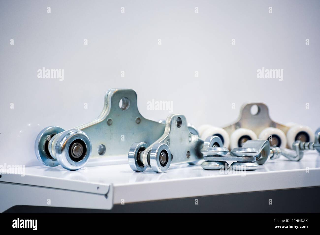 Carrier roller system for gates. Gate accessories Stock Photo Alamy
