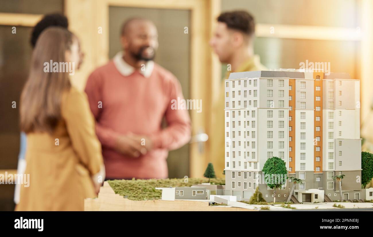 Architecture team, meeting and city model in office for construction