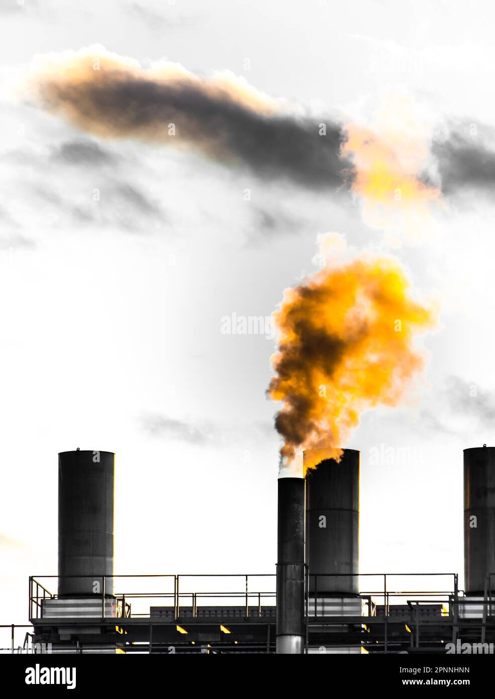 Air pollution from an smokestack of an old factory Stock Photo