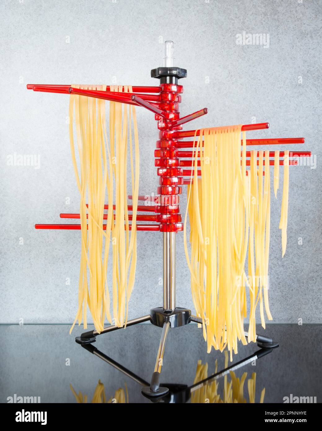 Selfmade italian tagliatelle hanging on a pasta drying rack Stock Photo Alamy