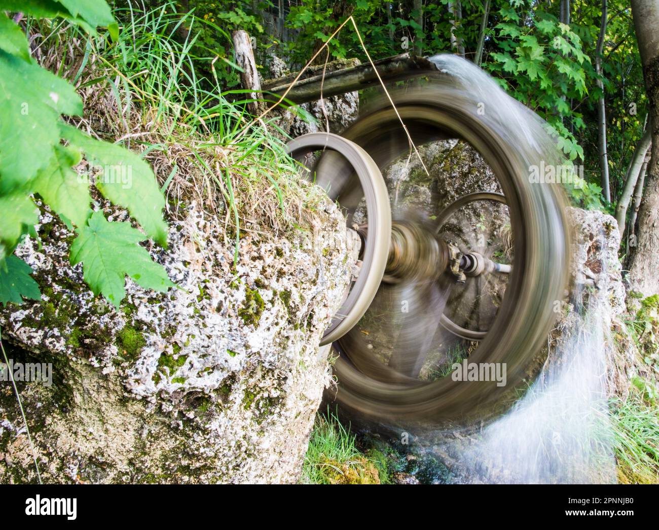 Blurred motion of a vintage spinning water wheel Stock Photo Alamy