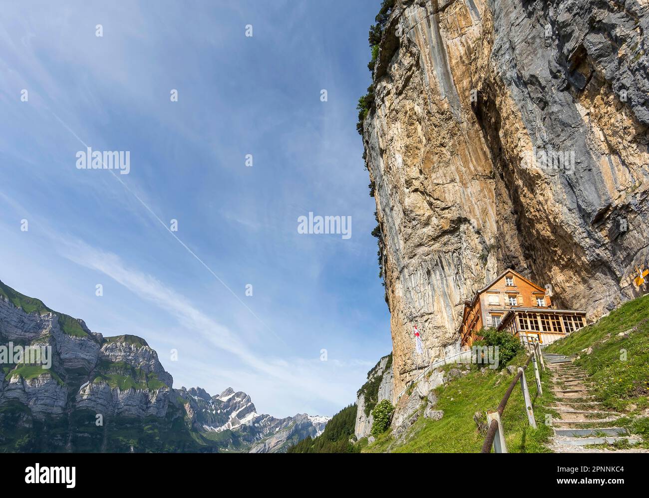 Aescher-Wildkirchli mountain inn, built into the rock below Ebenalp under a steep cliff. Weissbad, Canton Appenzell Innerrhoden, Switzerland Stock Photo