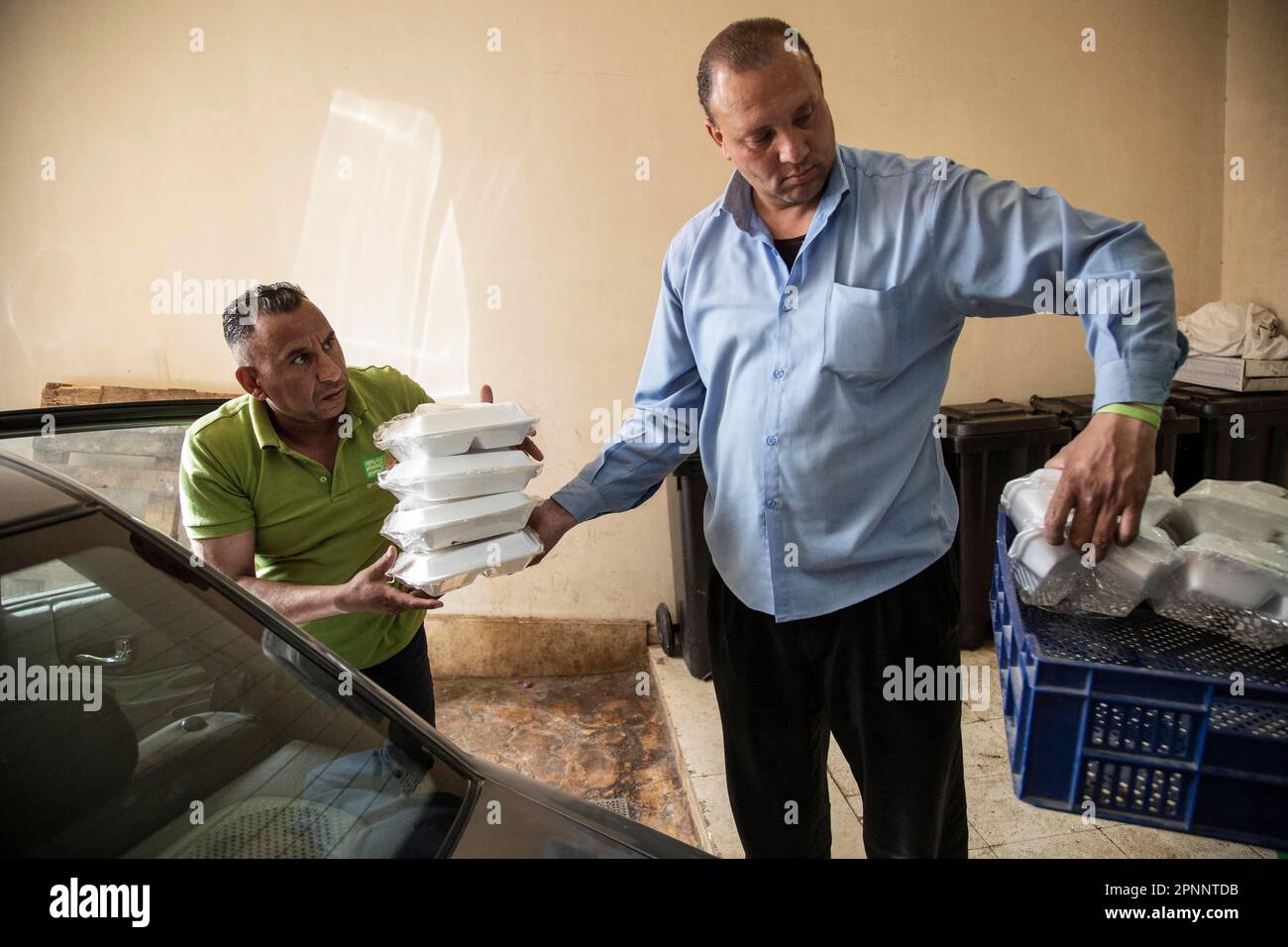 Cairo, Egypt. 19th Apr, 2023. Workers of the Egyptian Food Bank