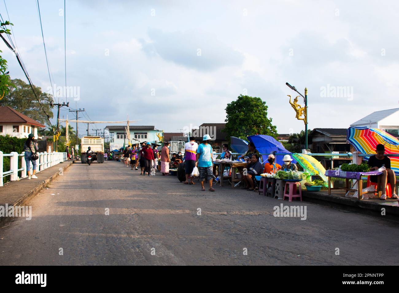 Thai people traveler travel visit and select buy shopping products goods food at local street market bazaar beside road morning time at Saen Suk Lampa Stock Photo