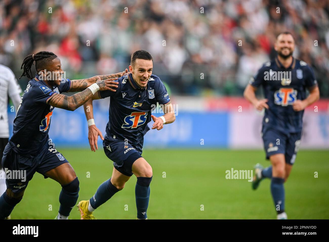 WARSAW, POLAND - APRIL 16, 2023: Polish Football League T-Mobile Ekstraklasa o/p: Alfonso Sousa (Lech) goal celebration with Afriel Ba Loua (Lech) Stock Photo