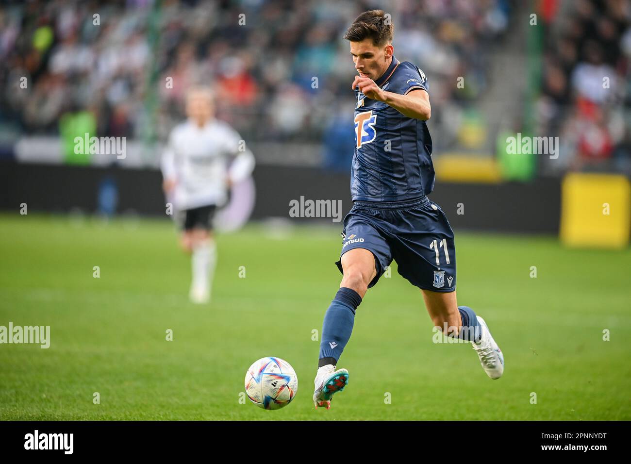 WARSAW, POLAND - APRIL 16, 2023: Polish Football League T-Mobile Ekstraklasa o/p: Filip Marchwinski (Lech) Stock Photo