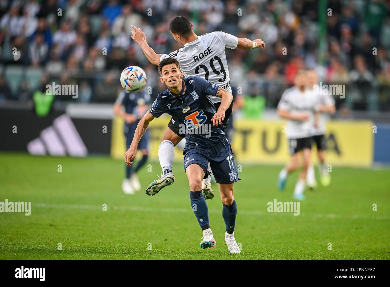 WARSAW, POLAND - APRIL 16, 2023: Polish Football League T-Mobile Ekstraklasa o/p: Filip Marchwinski (Lech) Lindsay Rose (Legia) Stock Photo