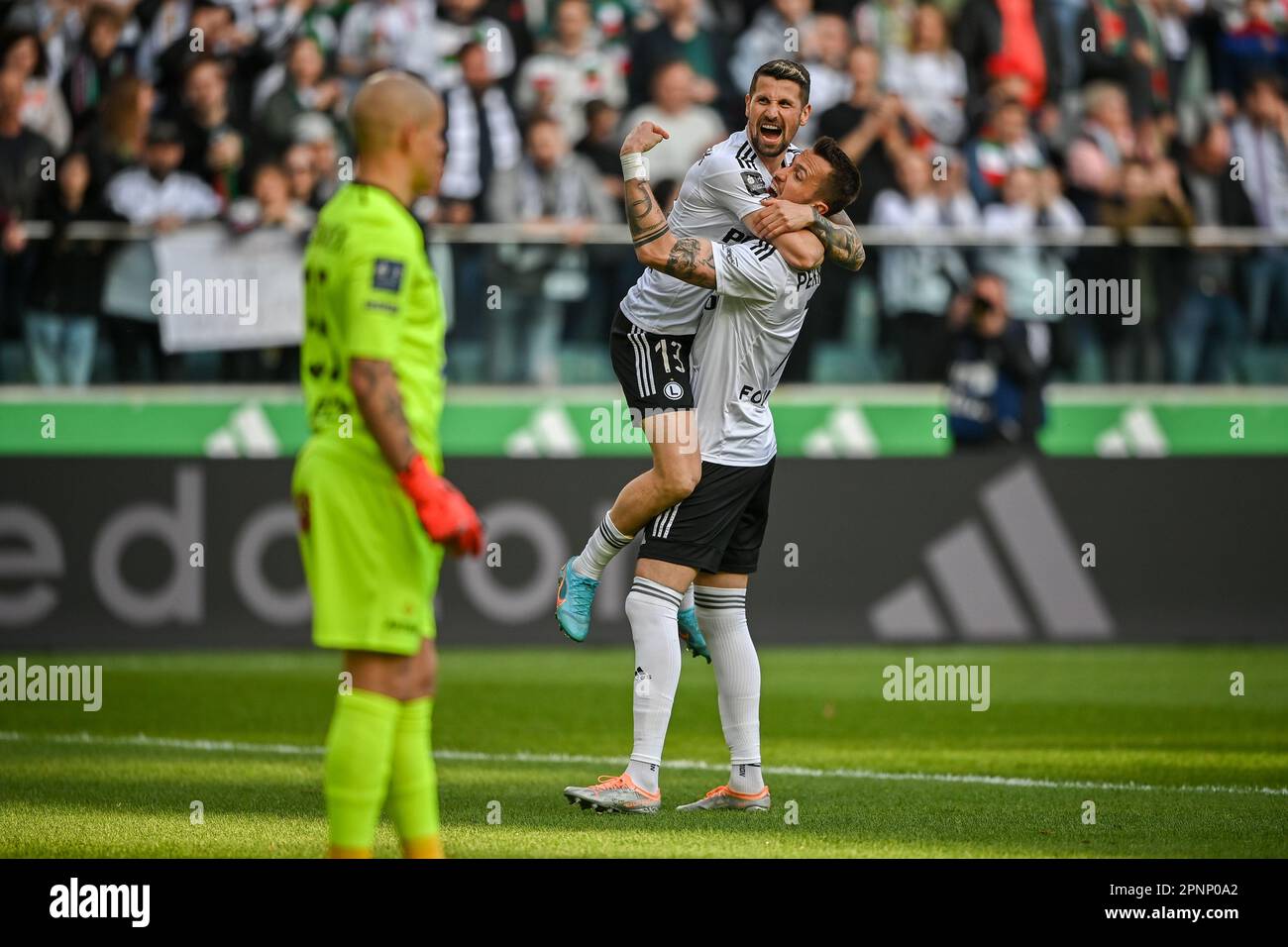 WARSAW, POLAND - APRIL 16, 2023: Polish Football League T-Mobile Ekstraklasa o/p: Tomas Pekhart (Legia) goal celebration with Pawel Wszolek (Legia) Stock Photo