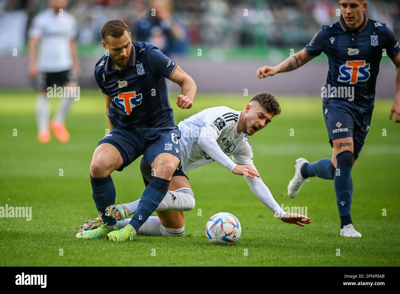 WARSAW, POLAND - APRIL 16, 2023: Polish Football League T-Mobile Ekstraklasa o/p: Jacper Kalstrom (Lech) Ernest Muci (Legia) Stock Photo