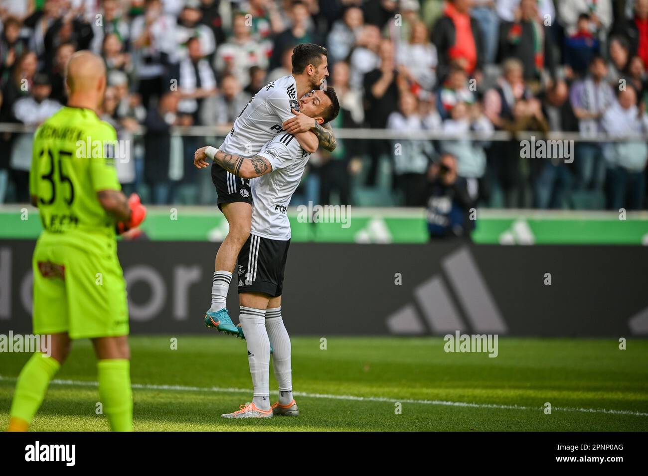 WARSAW, POLAND - APRIL 16, 2023: Polish Football League T-Mobile Ekstraklasa o/p: Tomas Pekhart (Legia) goal celebration with Pawel Wszolek (Legia) Stock Photo