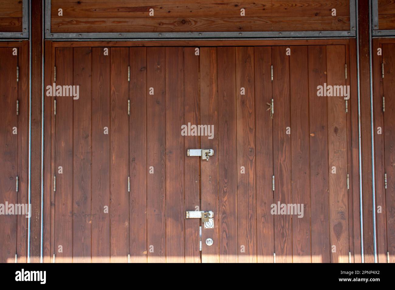 pale brown wooden doors to a market stall Stock Photo