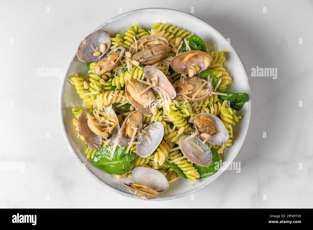Seafood pasta. Fusilli with clams vongole, parmesan cheese, spinach
