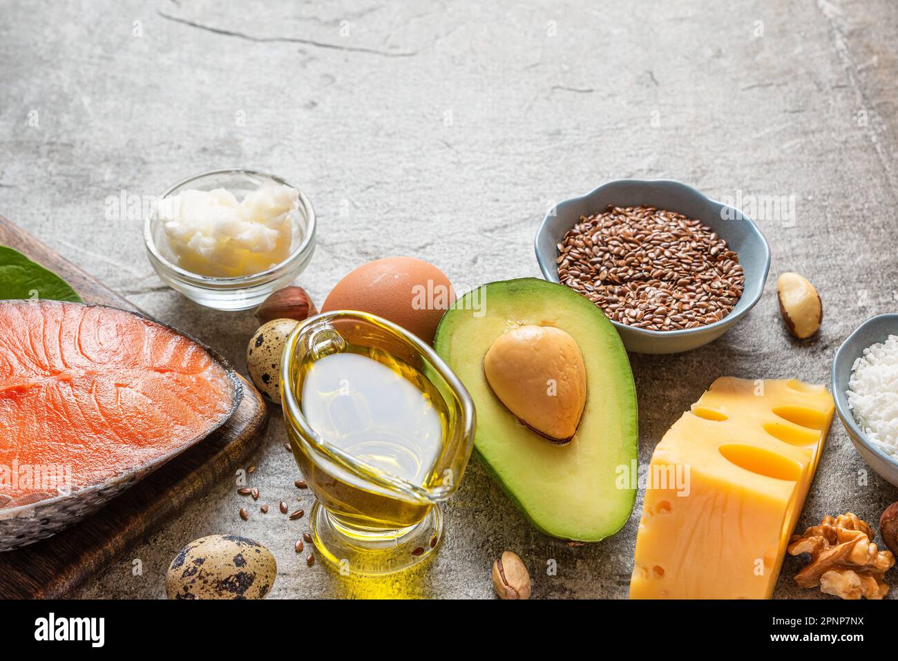 Low carb ketogenic diet with food rich with healthy fats and protein on concrete background. Healthy balanced food. Paleo diet Stock Photo