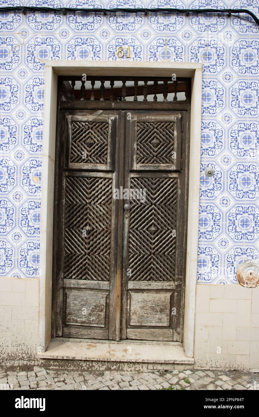 traditional wooden double doors in southern Portugal Stock Photo