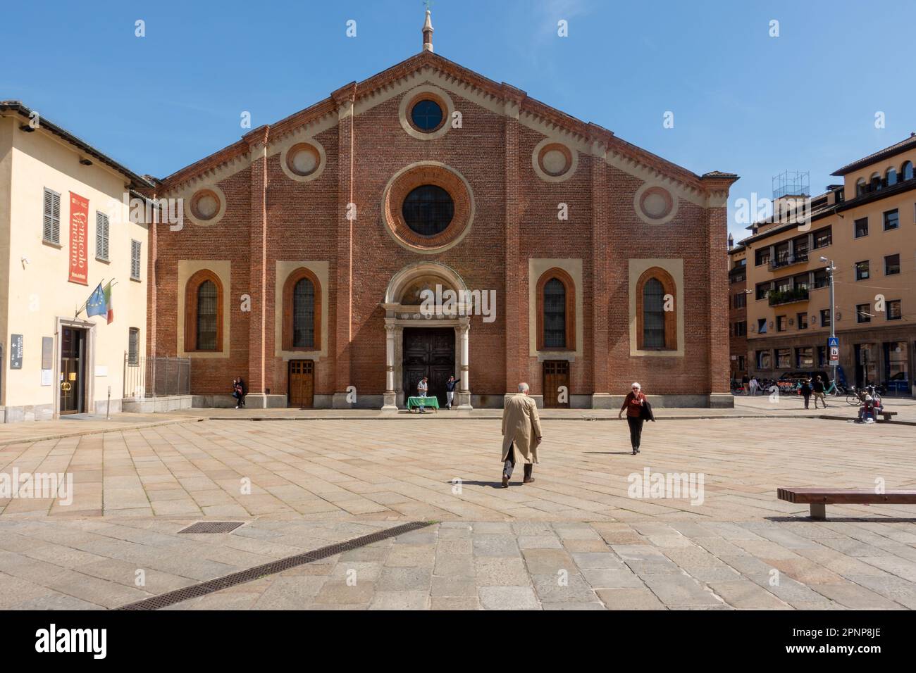 Frontal facade of the church of Santa Maria delle Grazie with people, which hosts the Last Supper painting by Leonardo Da Vinci. Church and Dominican Stock Photo